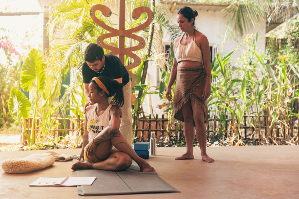 Newly certified yoga teacher leading a practice session after graduating from Sohum Yoga School